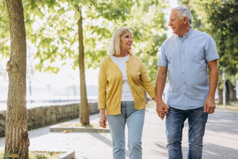 Portrait of beautiful senior couple posing in the park